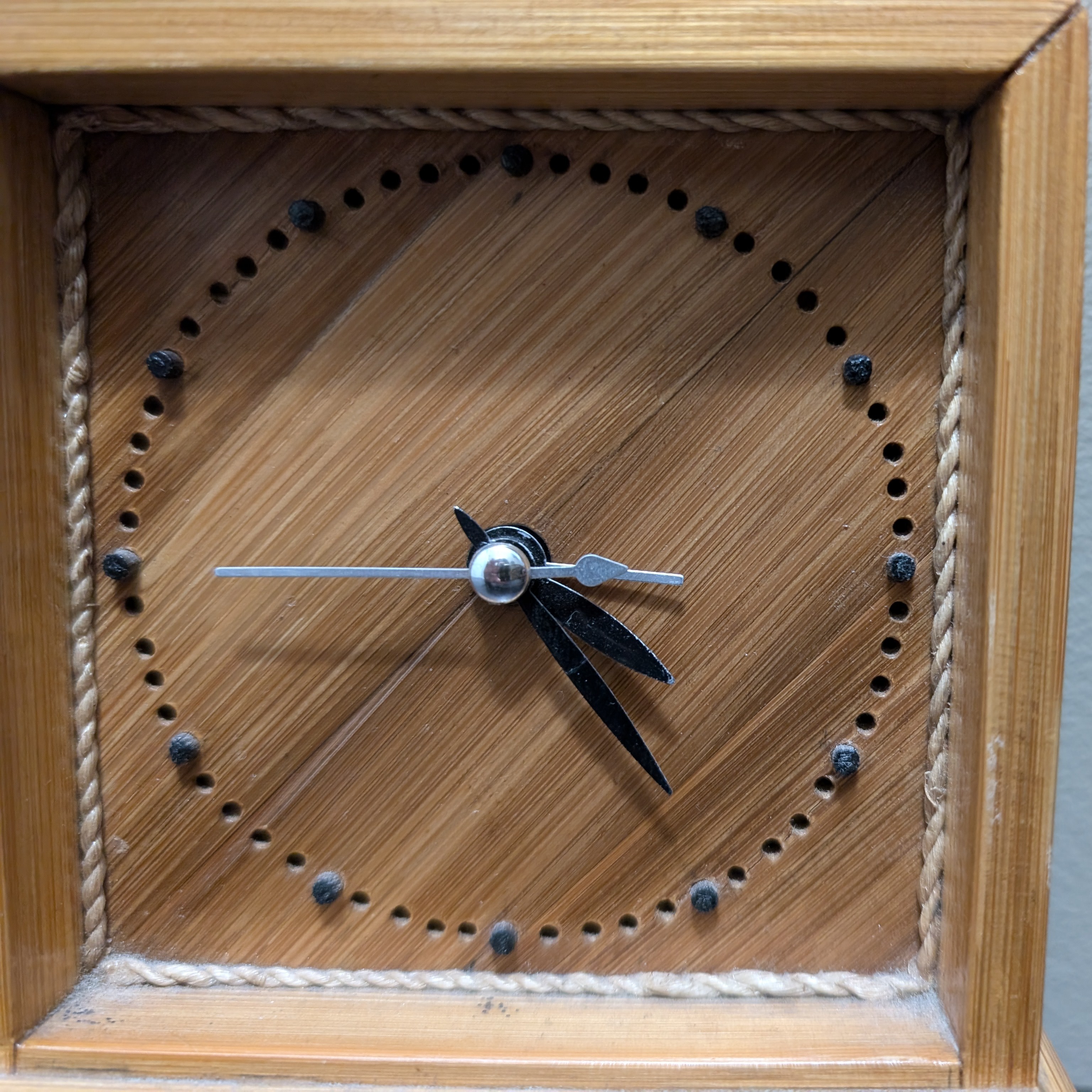 A close-up view of the wooden desk clock.