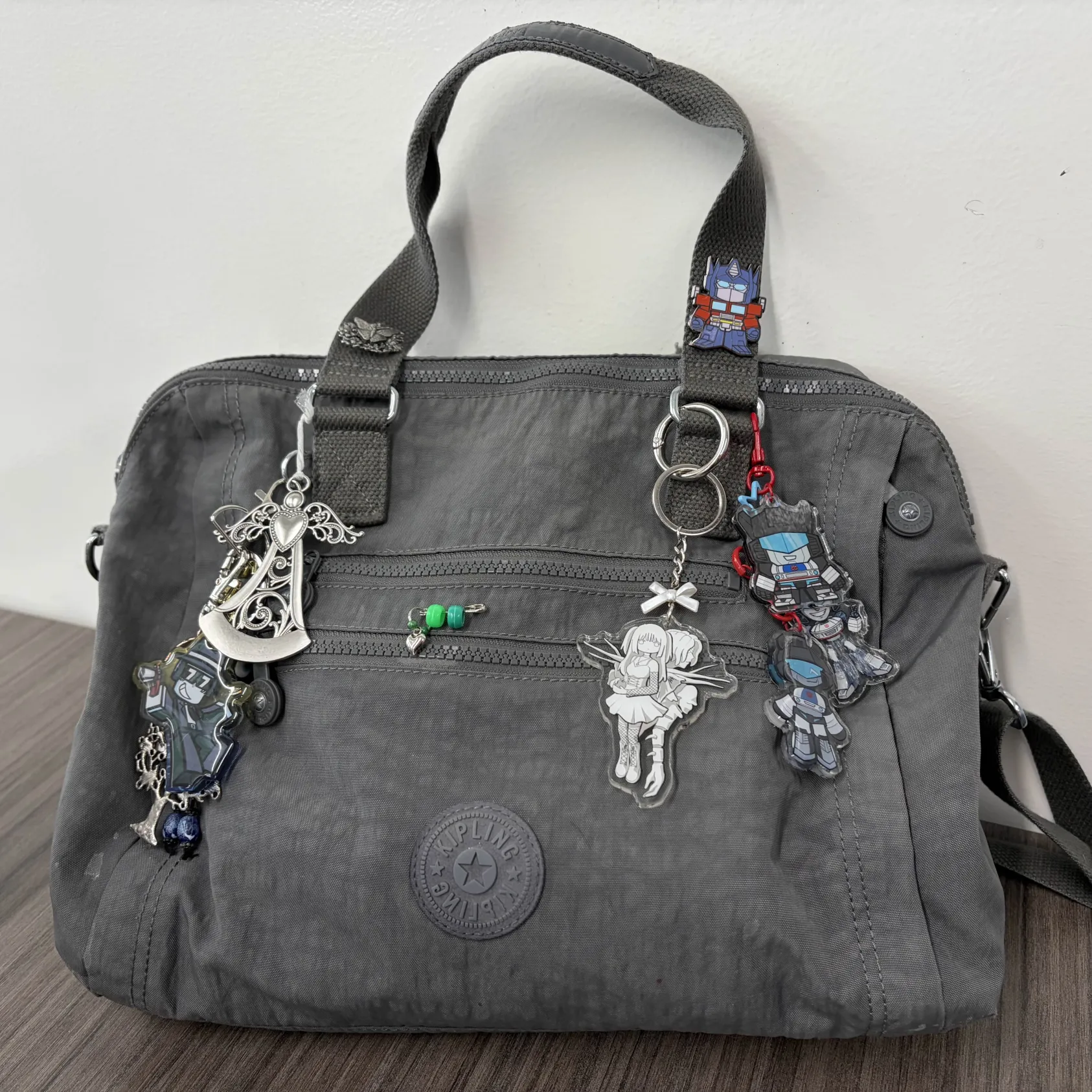The rustling of keychains against my grey bag.