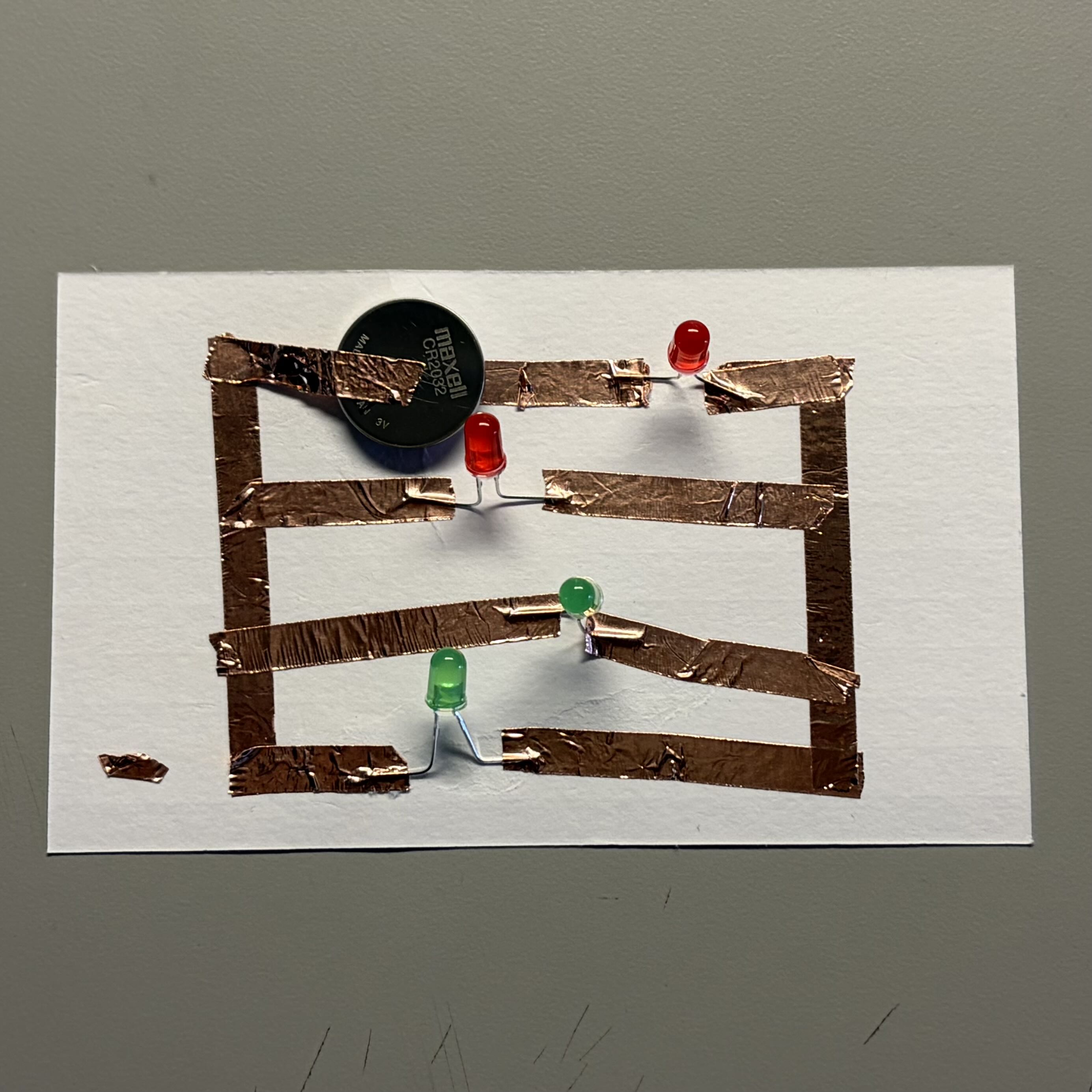 Maximum capacity of a 3V coin battery is 3 lights, so adding a 4th light to the board shuts it down