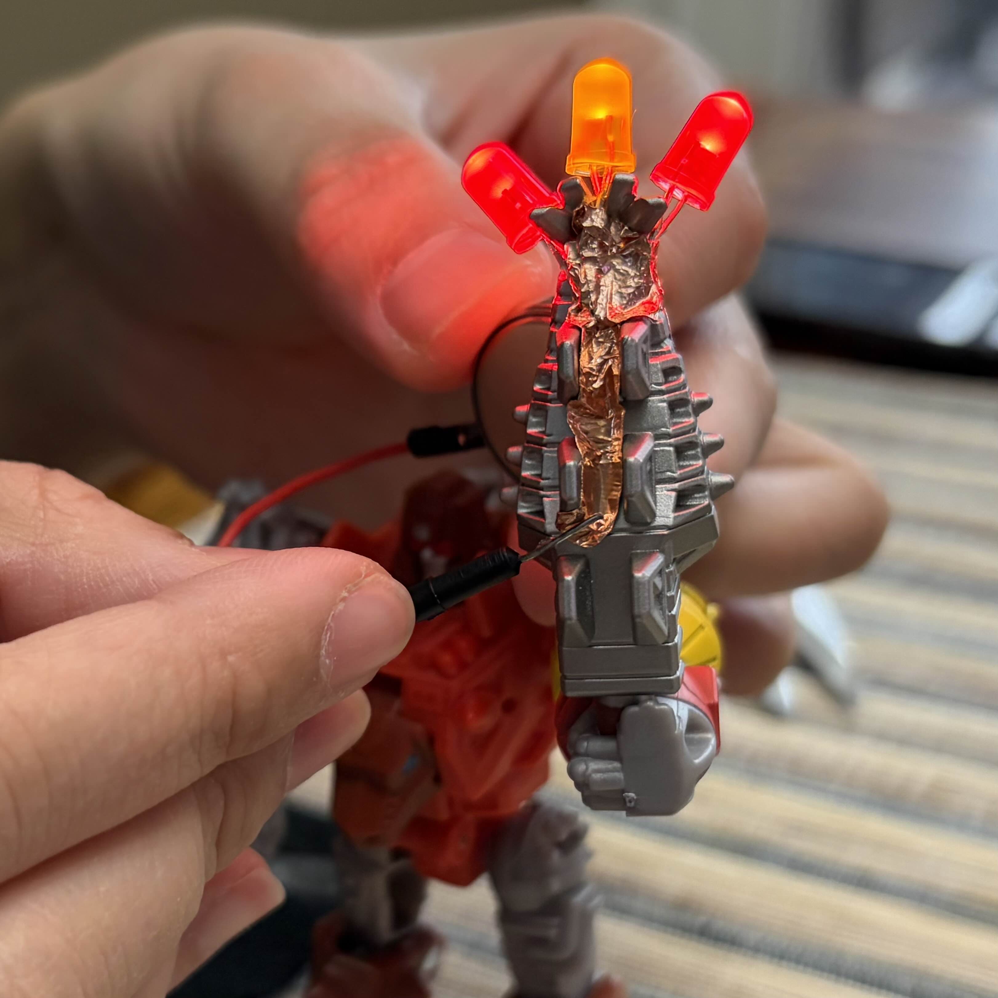 Initial experimentation with jumpwires to add lights to toys