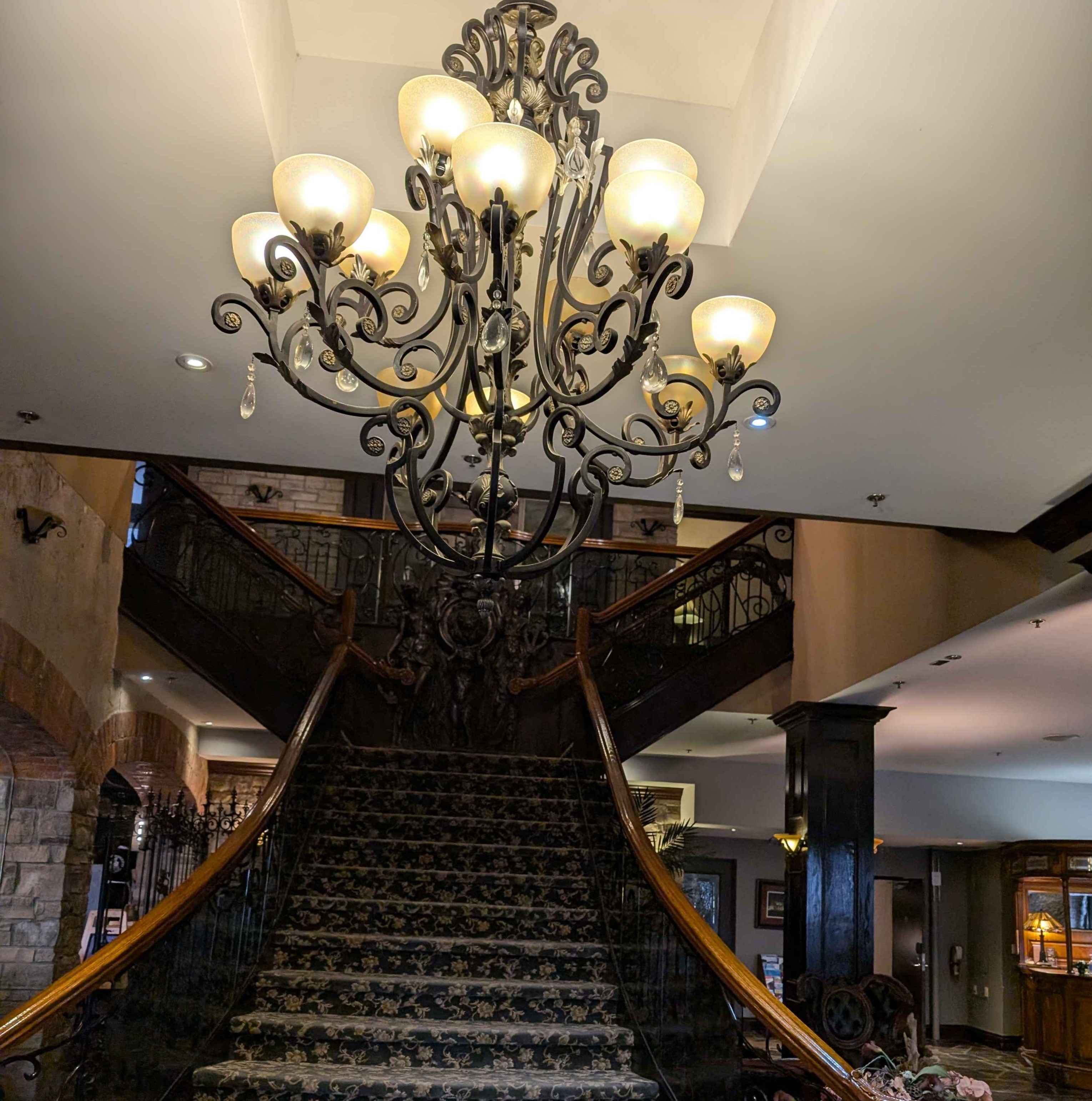 The lobby of Johnny Rocco's. There are stairs leading up to the second floor towards hotel rooms.