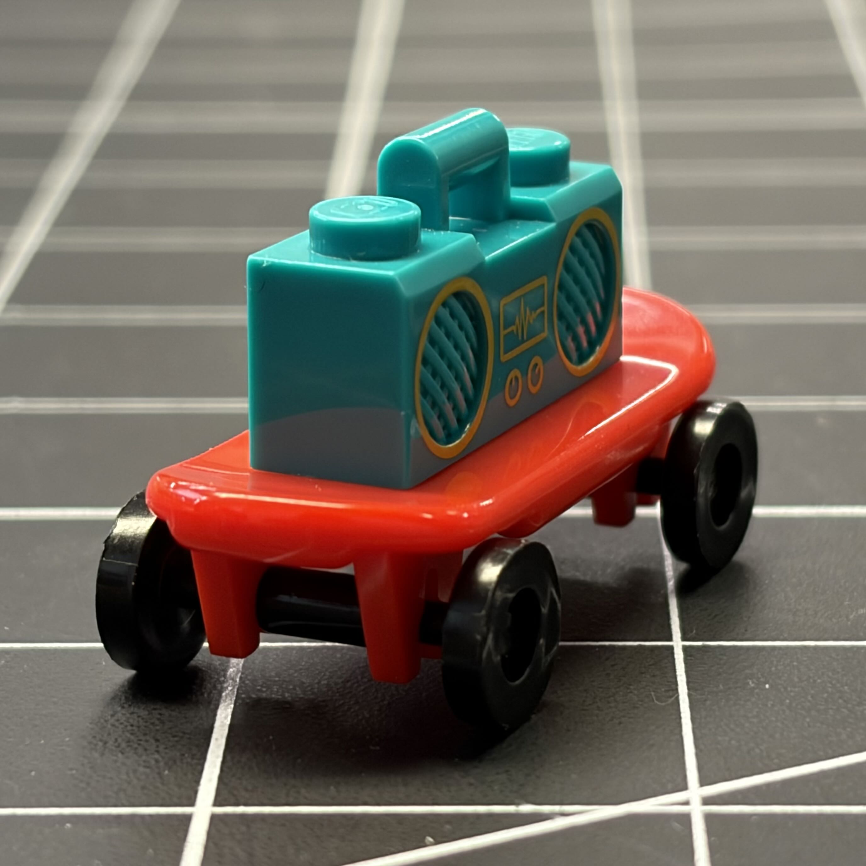 A side angle of my Lego boombox and my Lego skateboard.